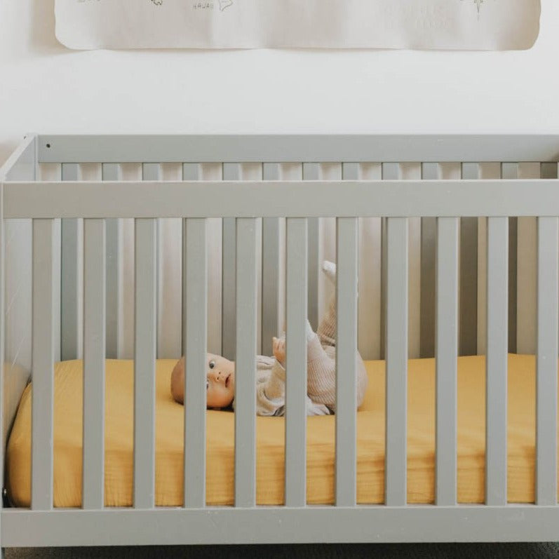 Little Unicorn Cotton Muslin Crib Sheet | Mustard