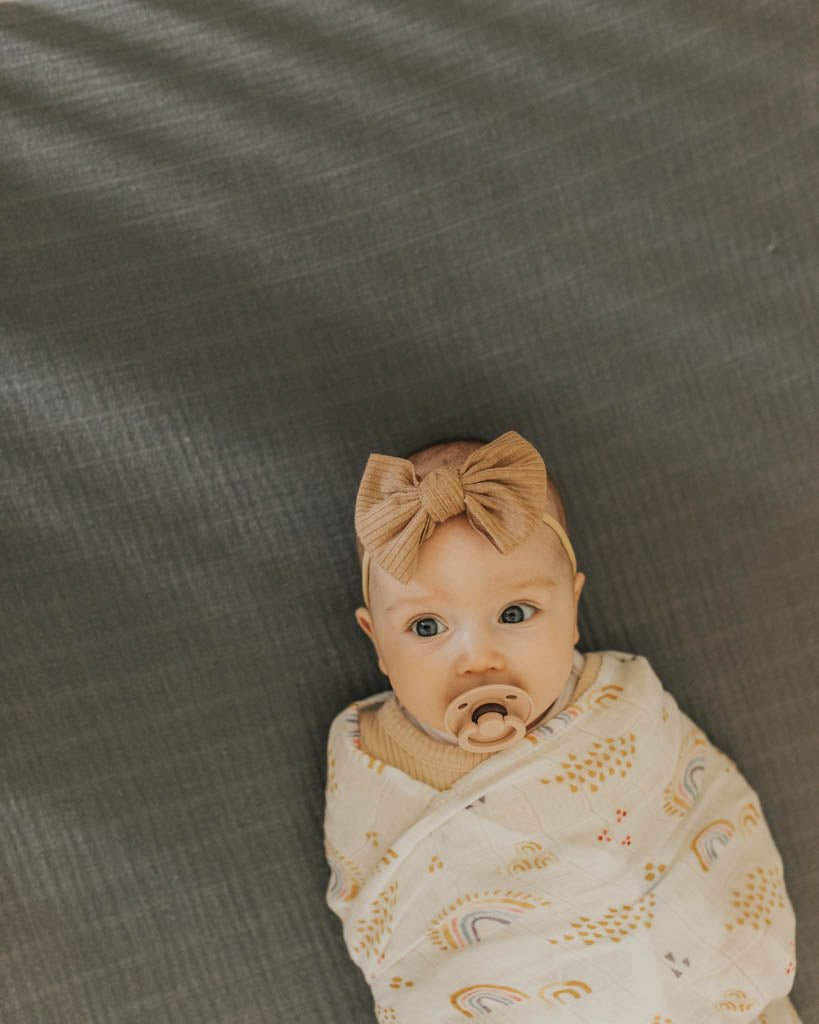 Little Unicorn Deluxe Muslin Swaddle Blanket | Rainbows & Raindrops