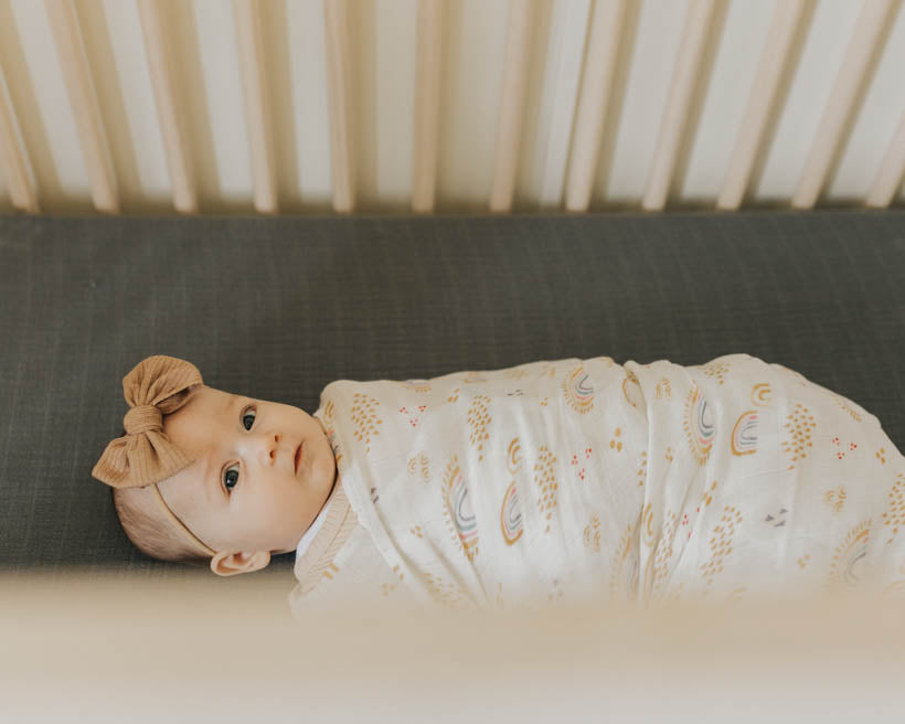 Little Unicorn Deluxe Muslin Swaddle Blanket | Rainbows & Raindrops