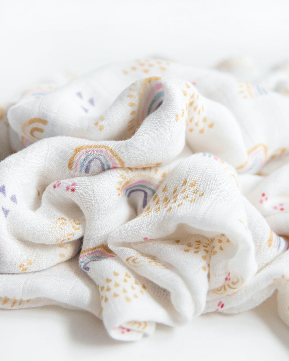 Little Unicorn Deluxe Muslin Swaddle Blanket | Rainbows & Raindrops