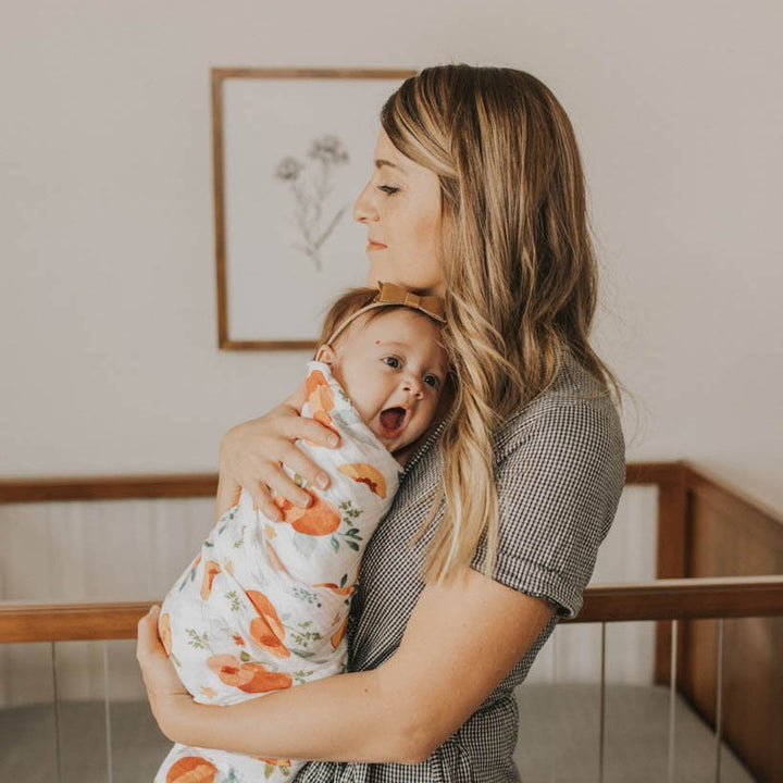 Little Unicorn Cotton Muslin Swaddle Blanket | Georgia Peach