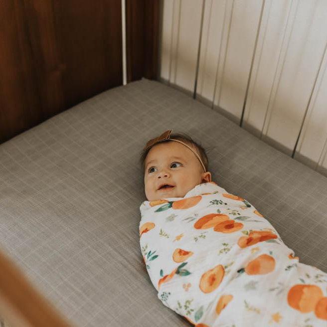 Little Unicorn Cotton Muslin Swaddle Blanket | Georgia Peach