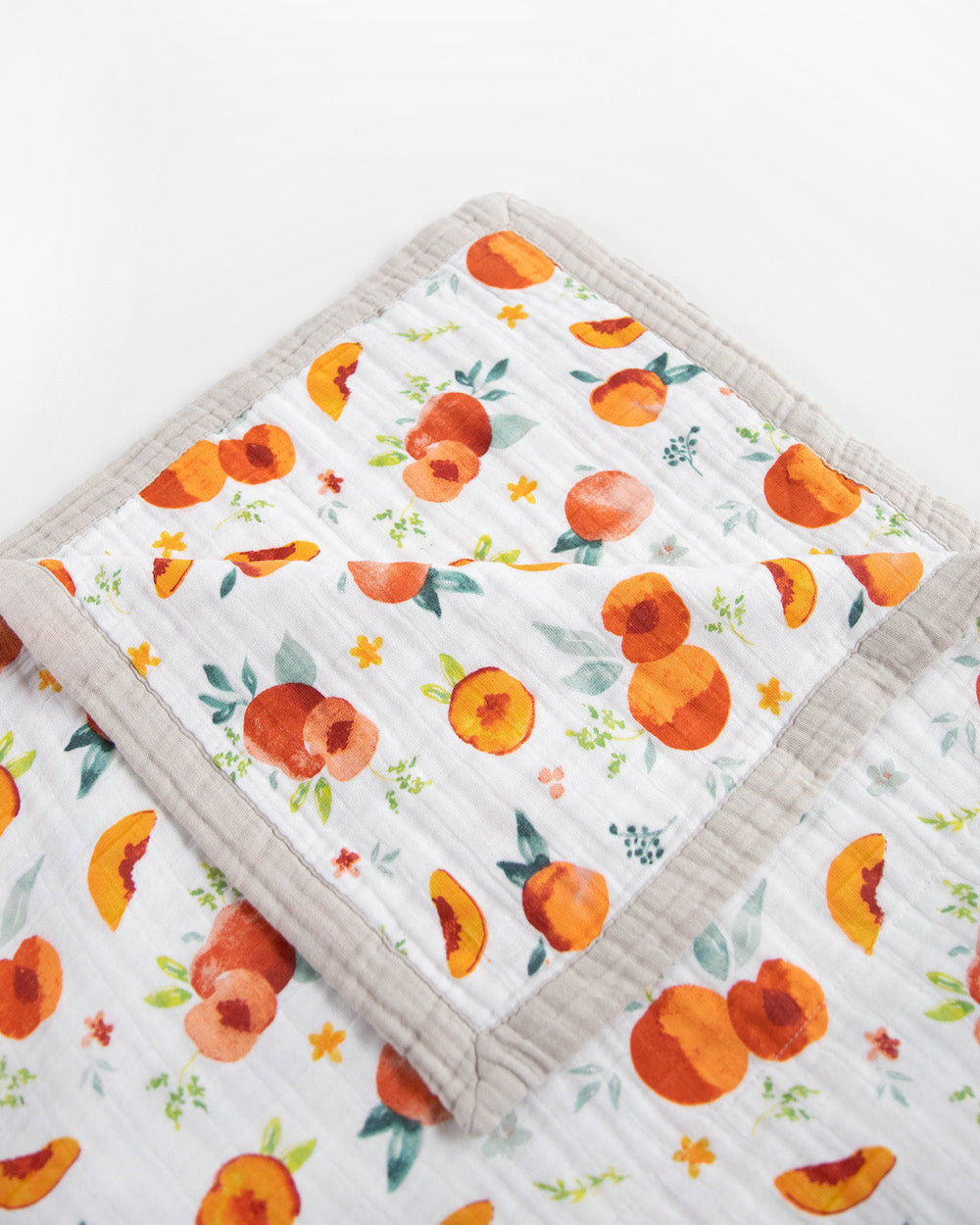 Little Unicorn Cotton Muslin Quilted Throw | Georgia Peach