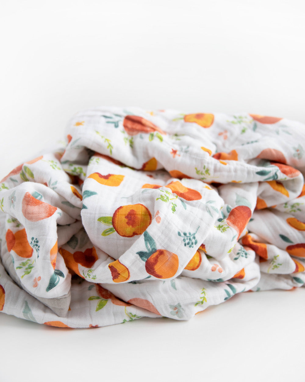 Little Unicorn Cotton Muslin Quilted Throw | Georgia Peach