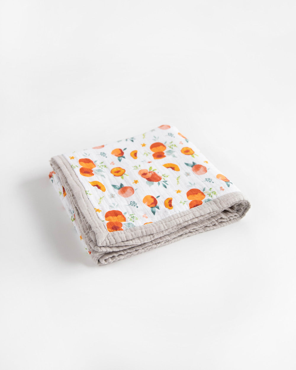 Little Unicorn Cotton Muslin Quilted Throw | Georgia Peach