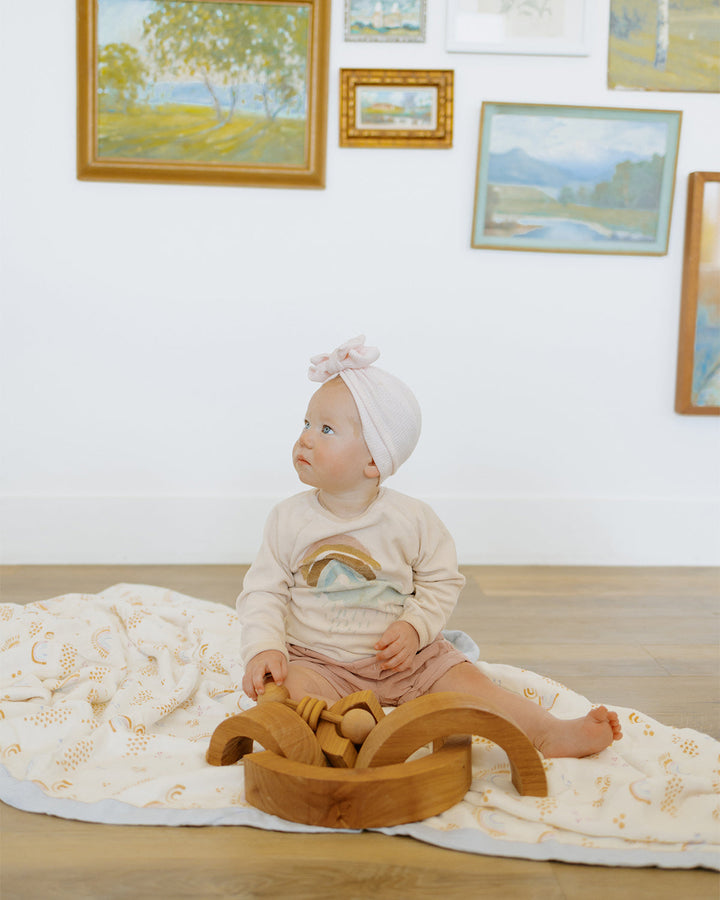 Little Unicorn Deluxe Muslin Quilted Throw | Rainbows & Raindrops