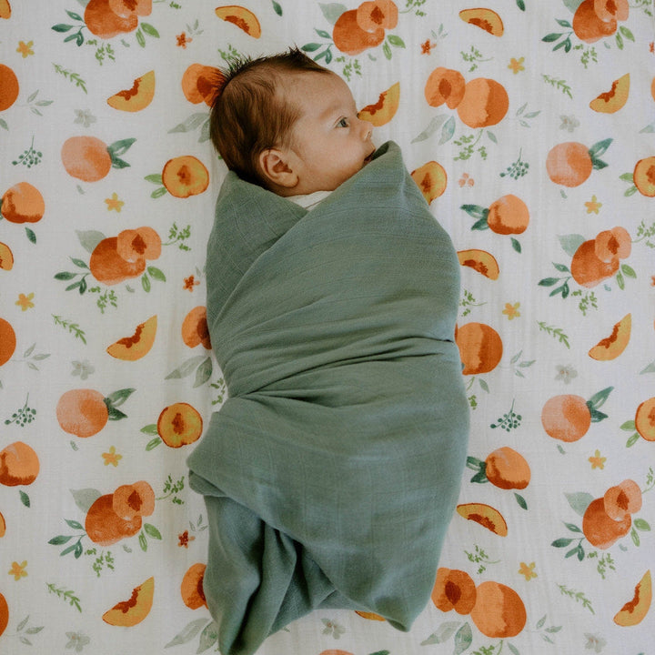 Little Unicorn Cotton Muslin Crib Sheet | Georgia Peach