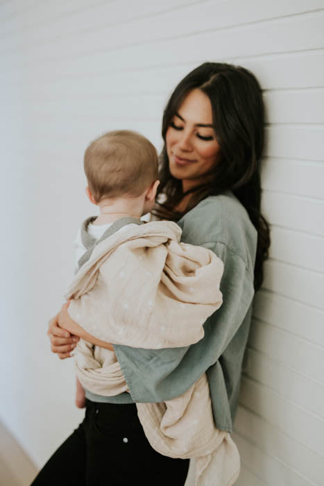 Little Unicorn Cotton Muslin Swaddle Blanket | Taupe Cross