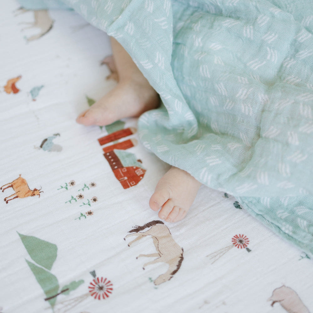 Little Unicorn Cotton Muslin Swaddle Blanket | Misty Field